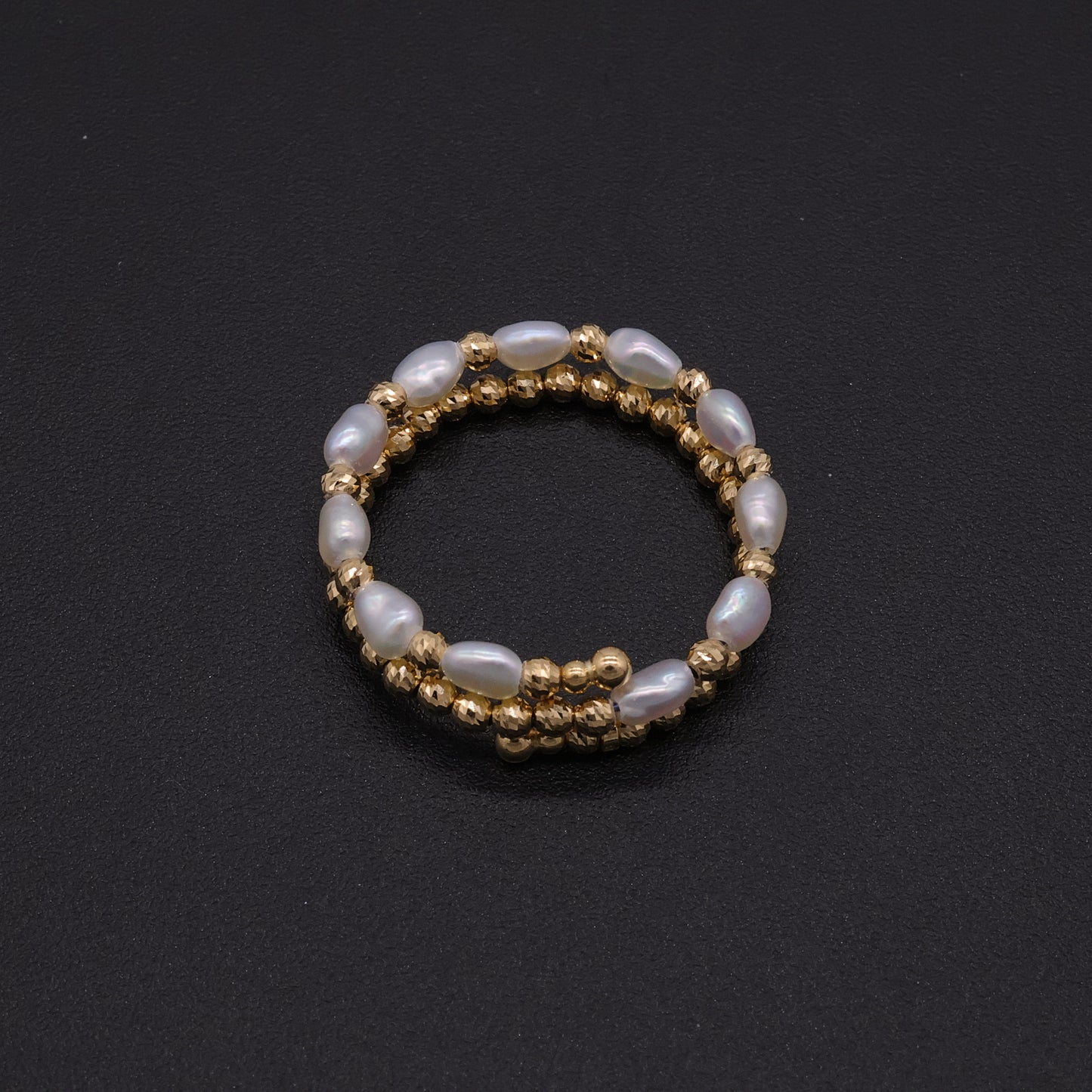 Adjustable Japanese keshi pearl memory-wire coil ring in 18k gold