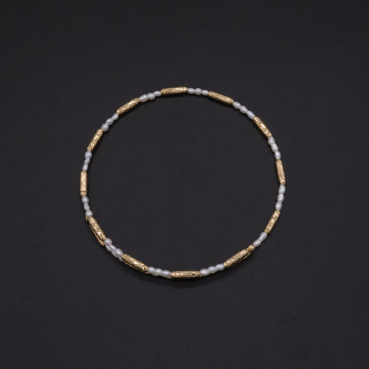 Adjustable Japanese keshi pearl memory-wire bracelet in 18k gold