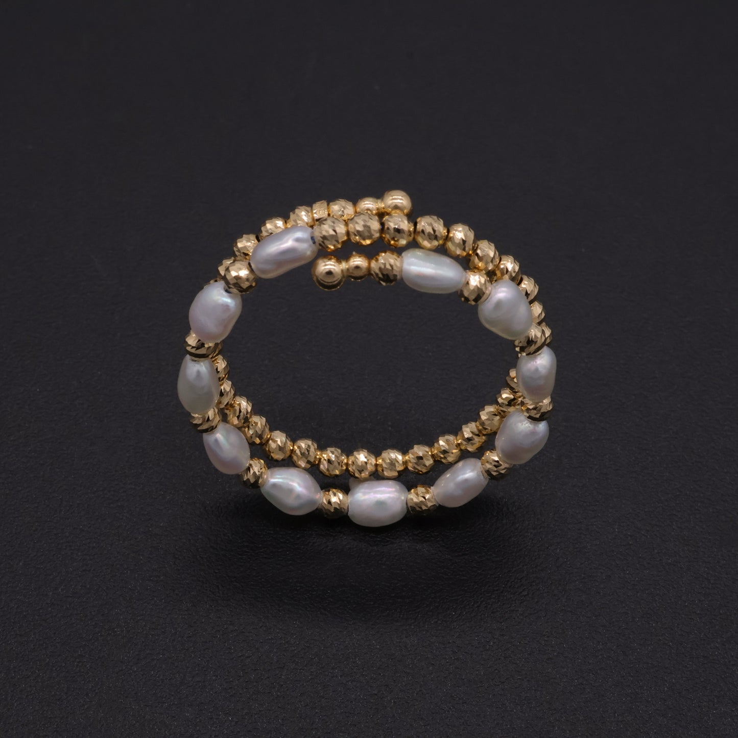 Adjustable Japanese keshi pearl memory-wire coil ring in 18k gold