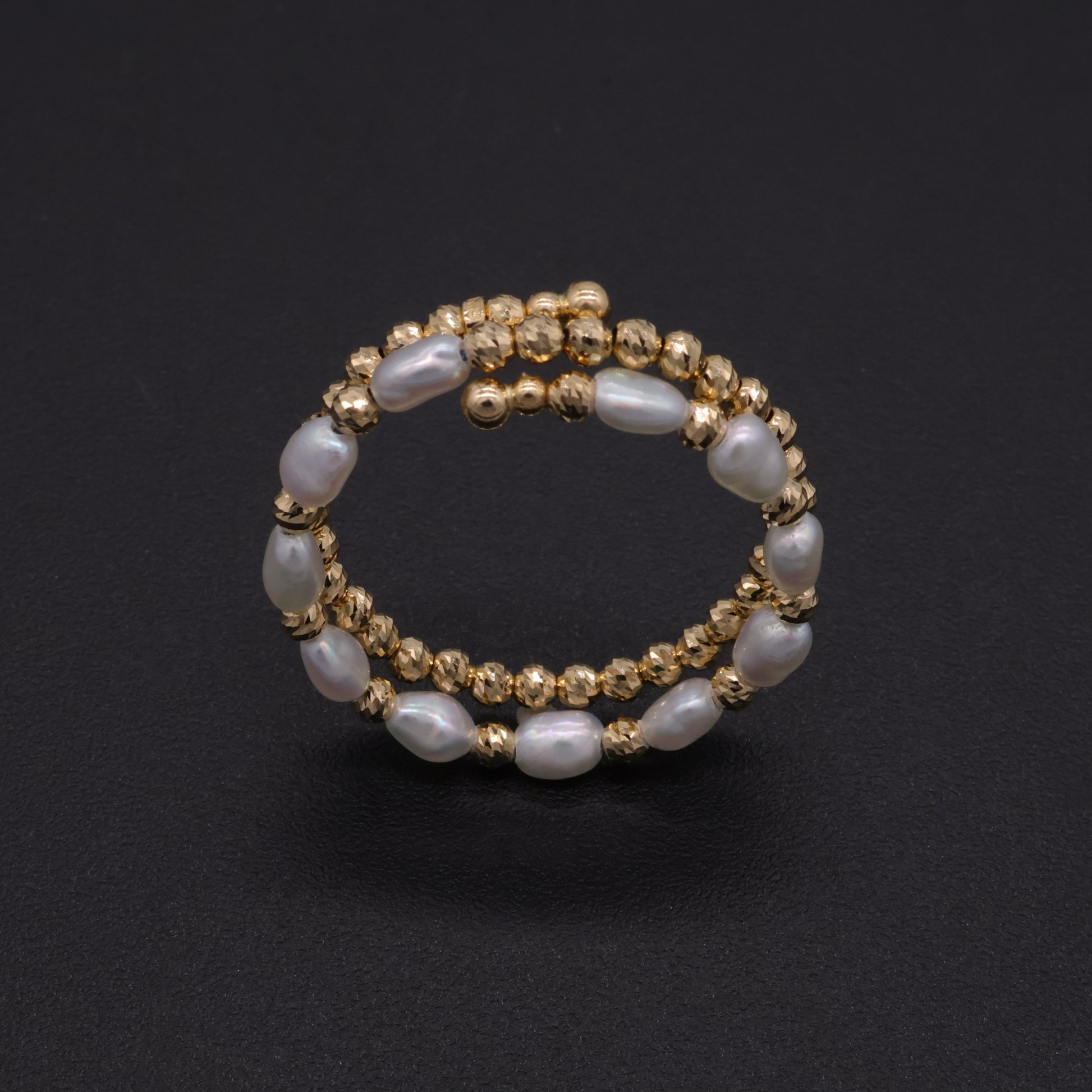Adjustable Japanese keshi pearl memory-wire coil ring in 18k gold