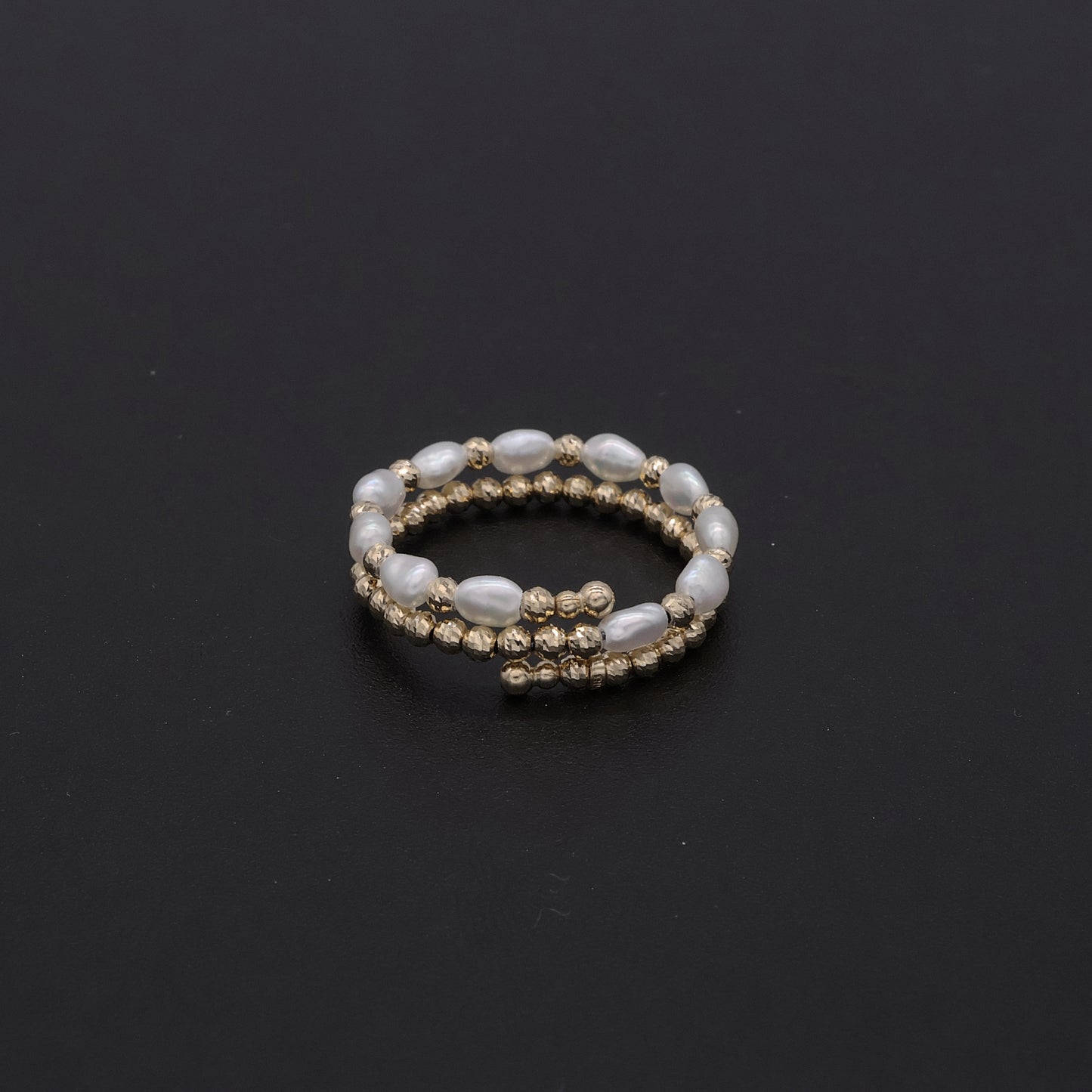 Adjustable Japanese keshi pearl memory-wire coil ring in 18k gold