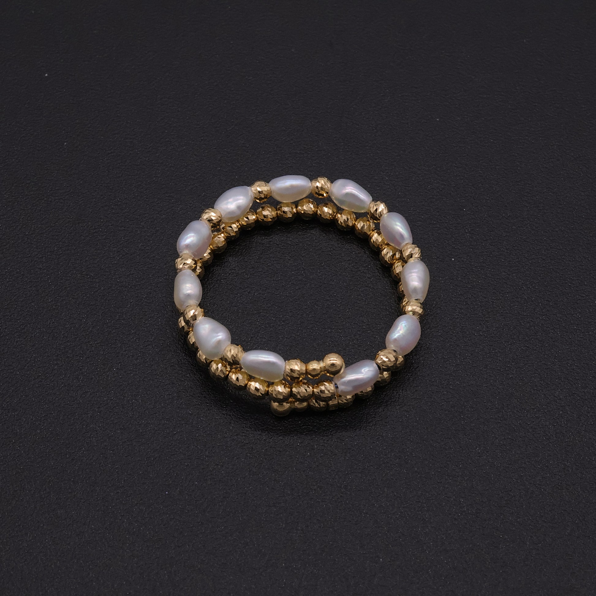 Adjustable Japanese keshi pearl memory-wire coil ring in 18k gold