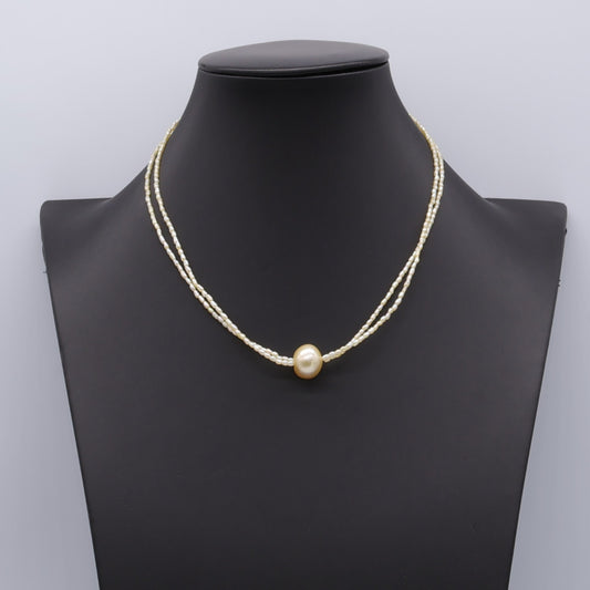 Champagne Akoya keshi pearl two-strand necklace with golden centre pearl and 18k gold clasp