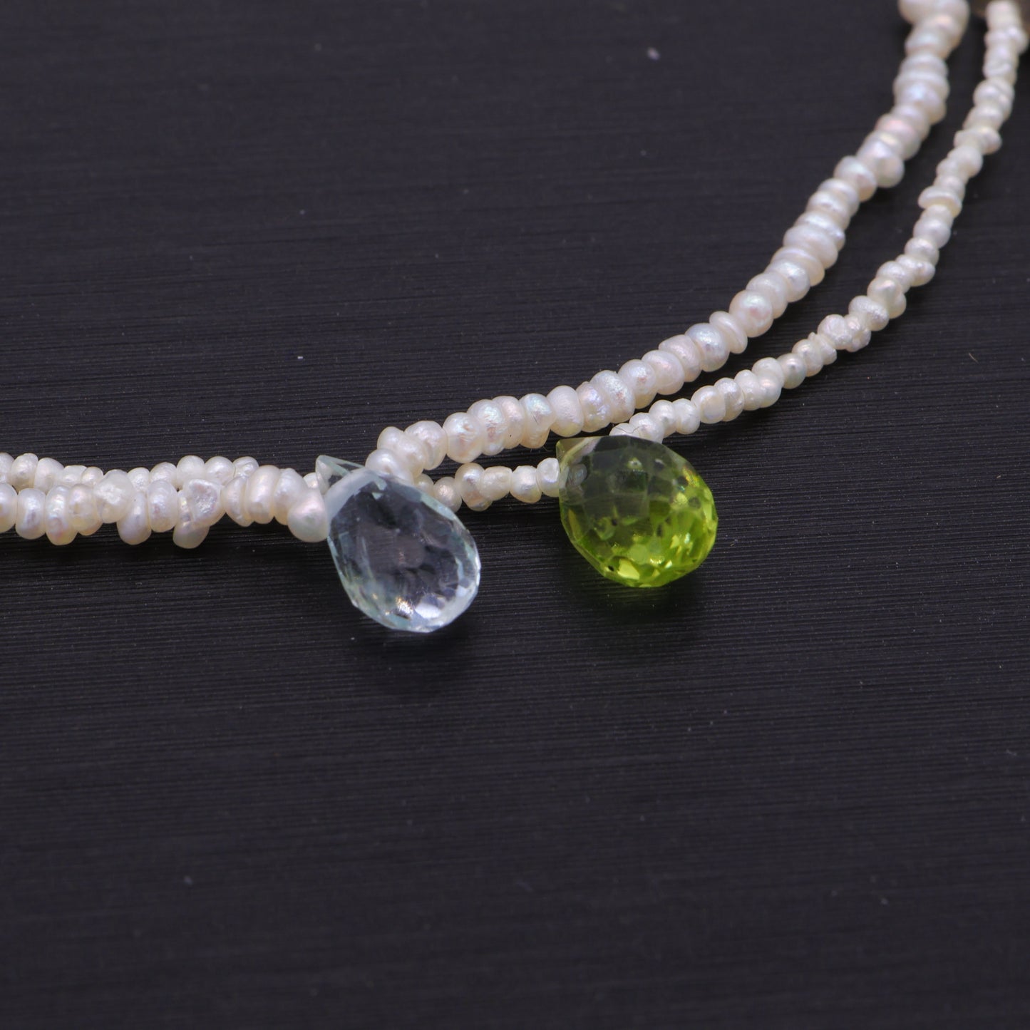 Hand-woven seed pearl bracelet with peridot, amethyst and aquamarine in sterling silver