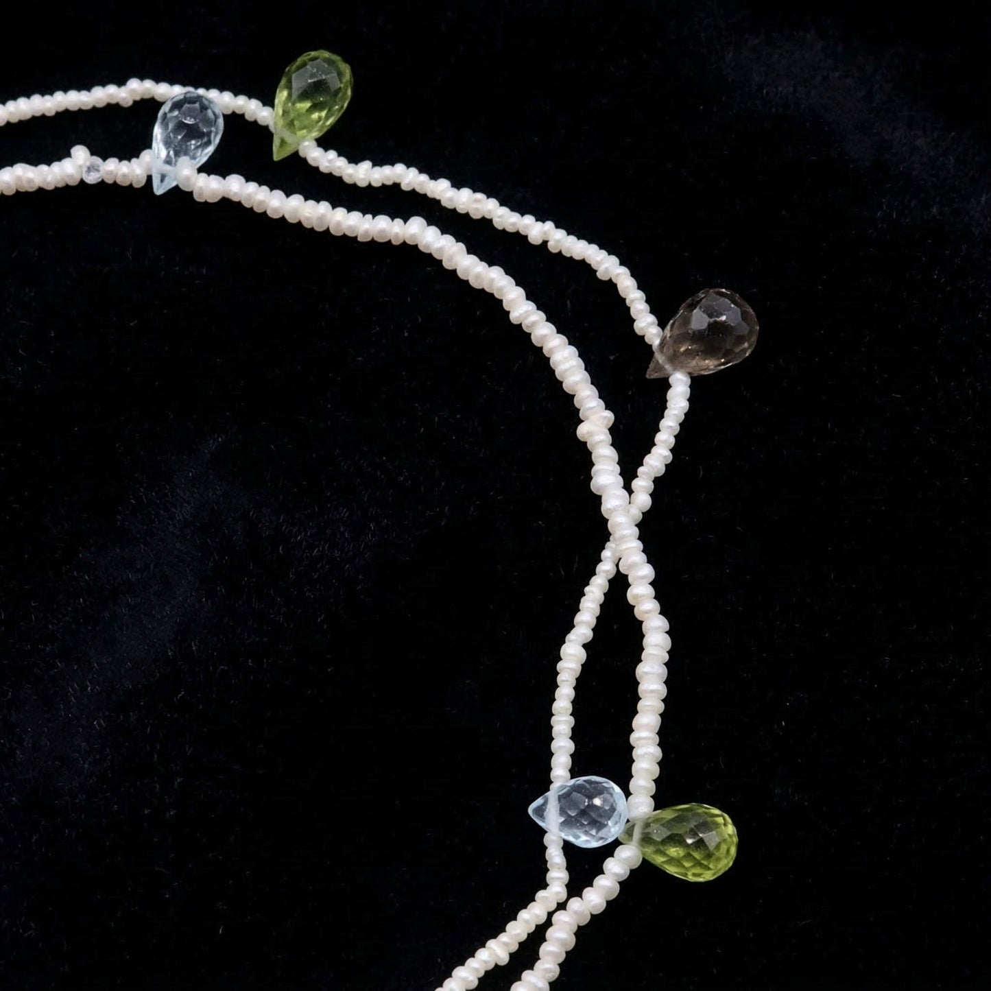 Hand-woven seed pearl bracelet with peridot, amethyst and aquamarine in sterling silver